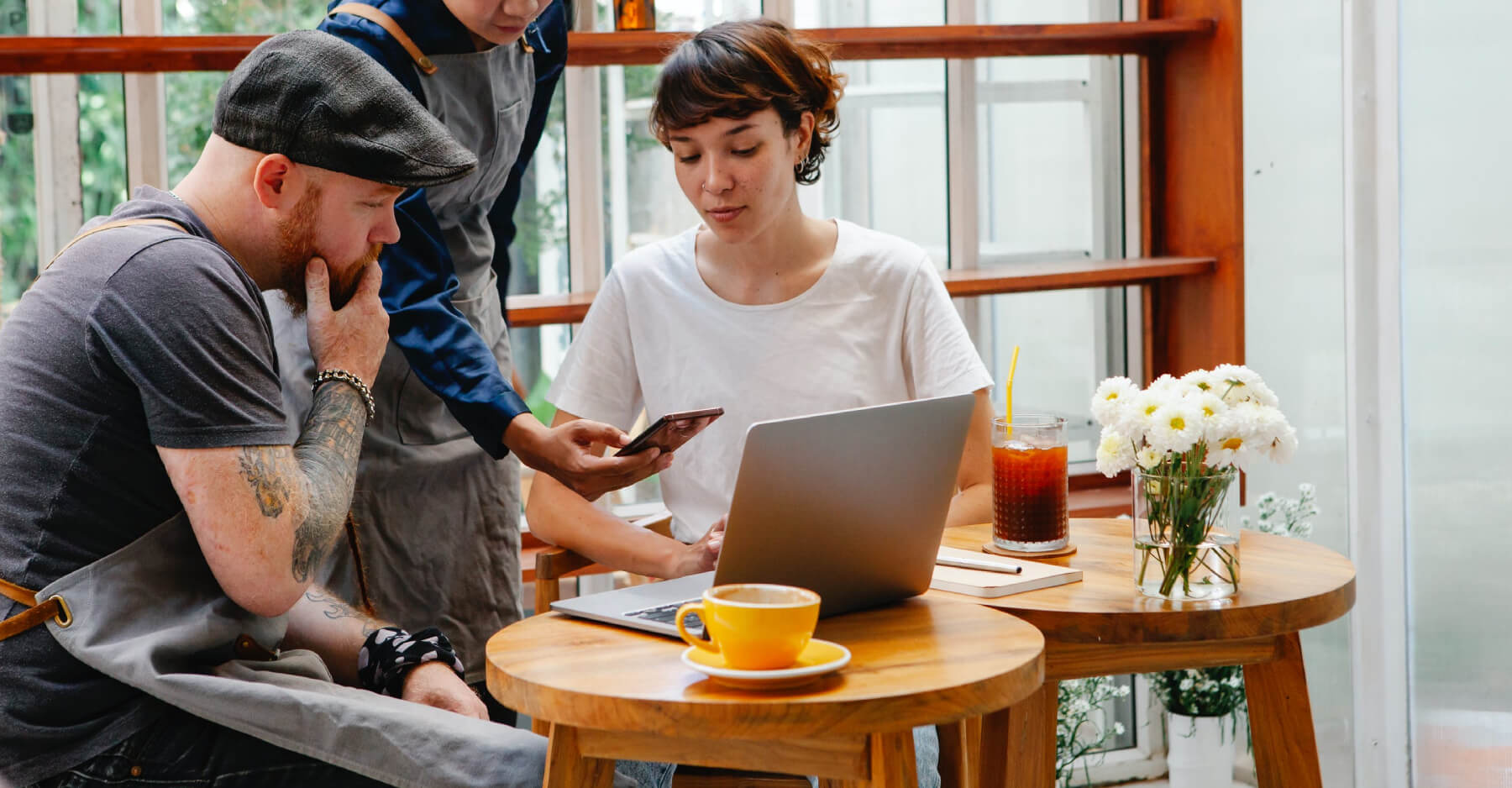 a man and a woman looking at a laptop